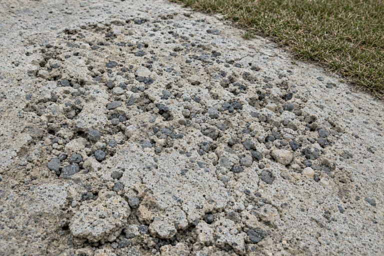 Close view of pitted flaking driveway concrete. Concrete Driveways in South Holland