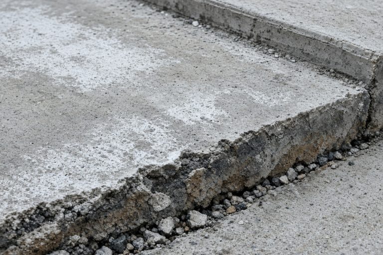 Scaled joint and chipped stall edge on a lot — Concrete Parking Lots in Calumet City
