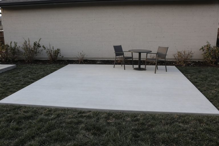 Finished patio with a table on a dry slab — Concrete Patios in Griffith