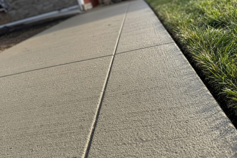 Close broom finish and control joint on a new walk — Concrete Removal Companies in Lowell