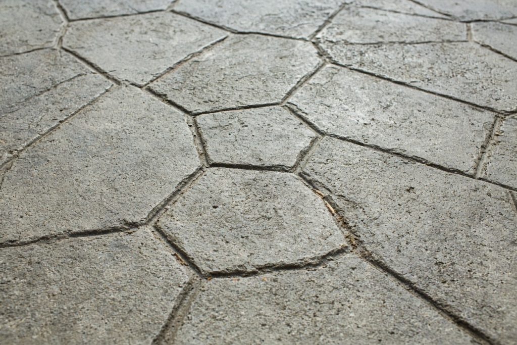 Close-up of stamped concrete texture on an outdoor patio — Decorative Concrete in Porter
