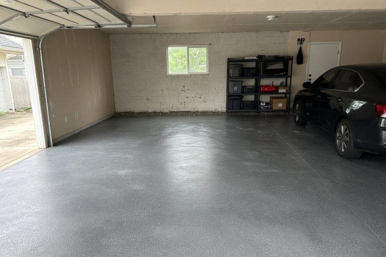 Finished gray epoxy garage floor with a clear tire path — Epoxy Flooring in Hammond