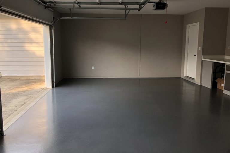 Smooth finished epoxy garage floor in a clean attached garage — Epoxy Flooring in Munster