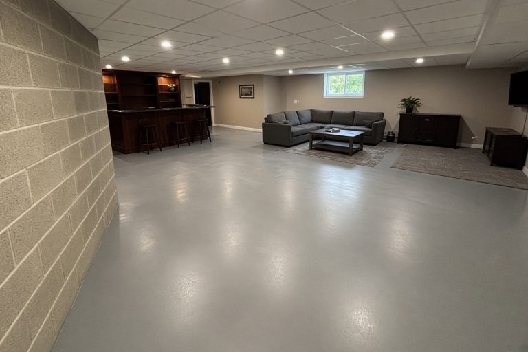 Smooth epoxy coating across a finished basement floor — Epoxy Flooring in Valparaiso