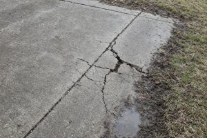Open cracks along a patio joint after winter — Concrete Patios in Hebron