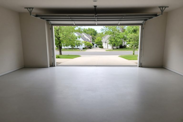 Smooth finished garage slab with the overhead door open — Concrete Garage Floors in South Haven
